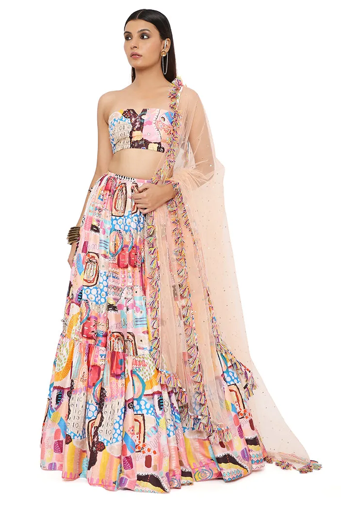 AMALIA TRANCE PRINT DUPION SILK EMBROIDERED BUSTIER WITH FRILL HEM LEHENGA AND MUKAISH NET DUPATTA