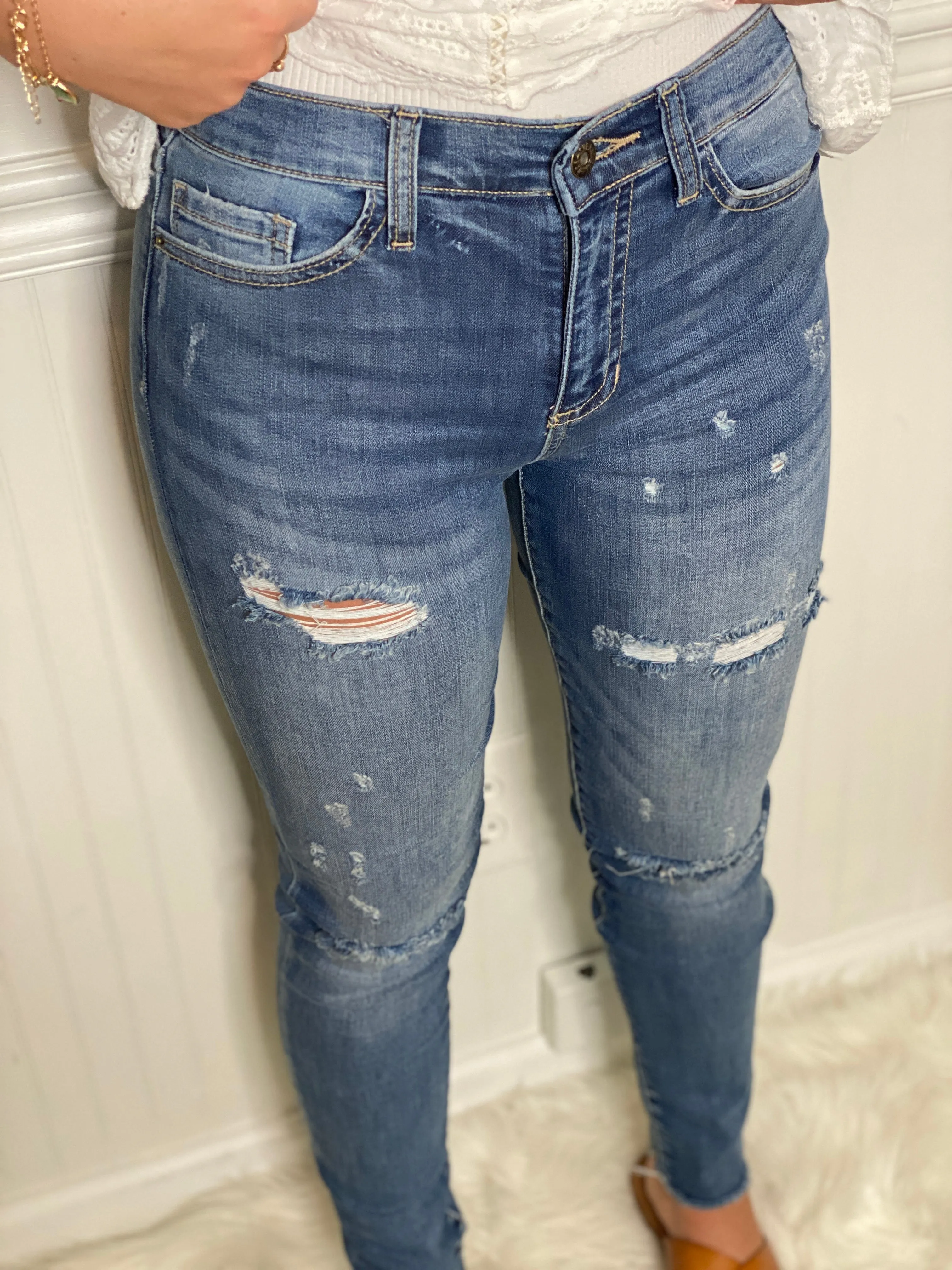 Distressed Mid Rise Skinny Jeans