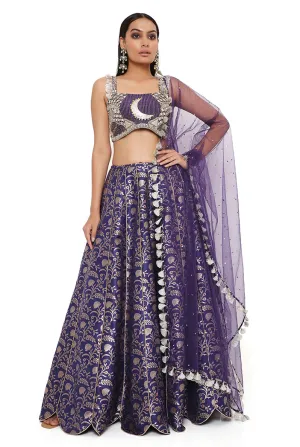 NINA NAVY DUPION SILK BROCADE EMBROIDERED BUSTIER WITH BROCADE LEHENGA AND MUKAISH NET DUPATTA