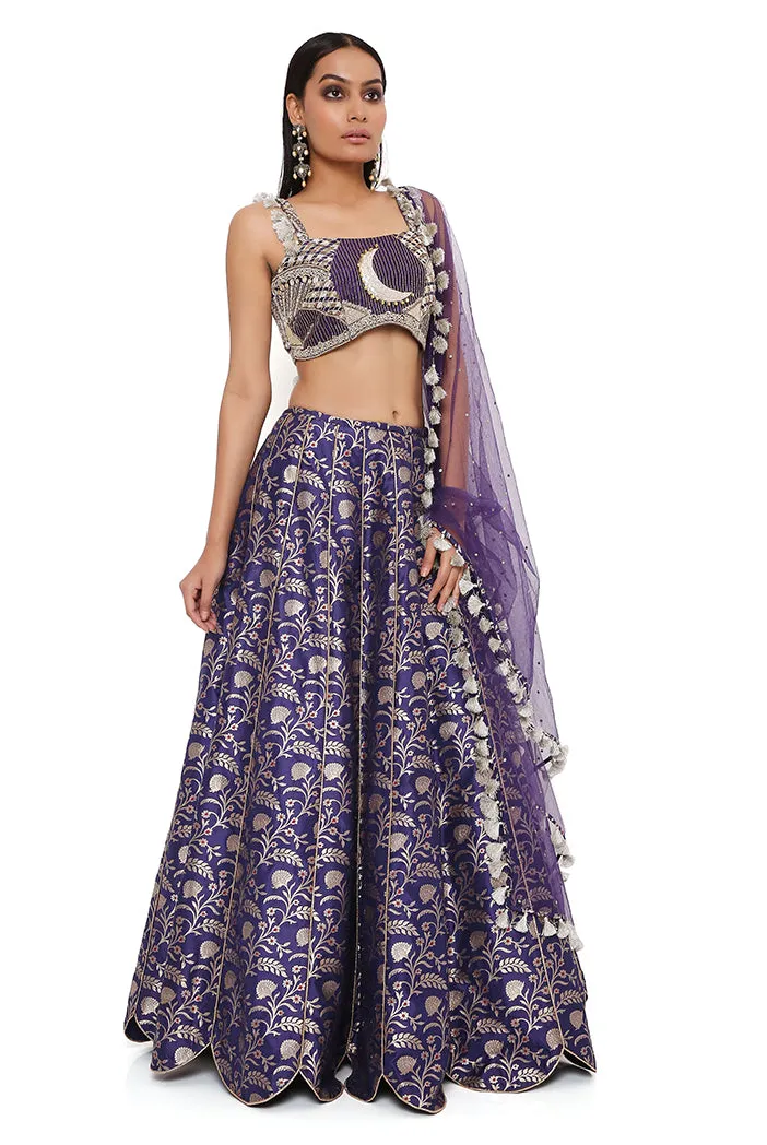 NINA NAVY DUPION SILK BROCADE EMBROIDERED BUSTIER WITH BROCADE LEHENGA AND MUKAISH NET DUPATTA