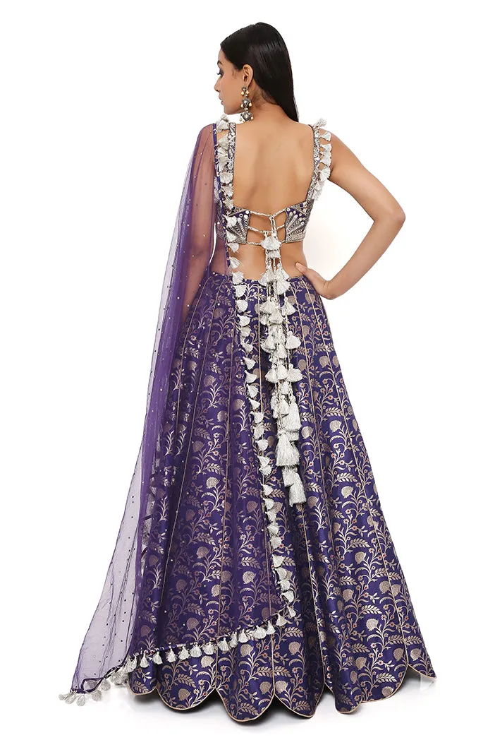NINA NAVY DUPION SILK BROCADE EMBROIDERED BUSTIER WITH BROCADE LEHENGA AND MUKAISH NET DUPATTA