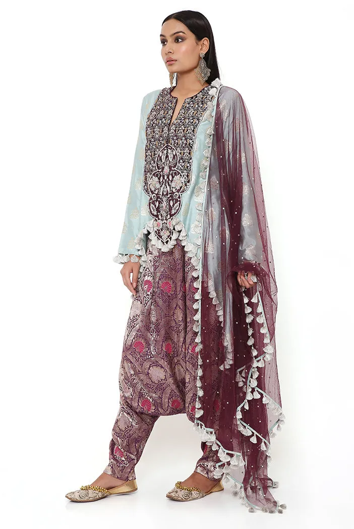 POWDER BLUE BROCADE SILK HIGH LOW KURTA WITH PURPLE BROCADE LOW CROTCH PANT AND PURPLE MUKAISH NET DUPATTA
