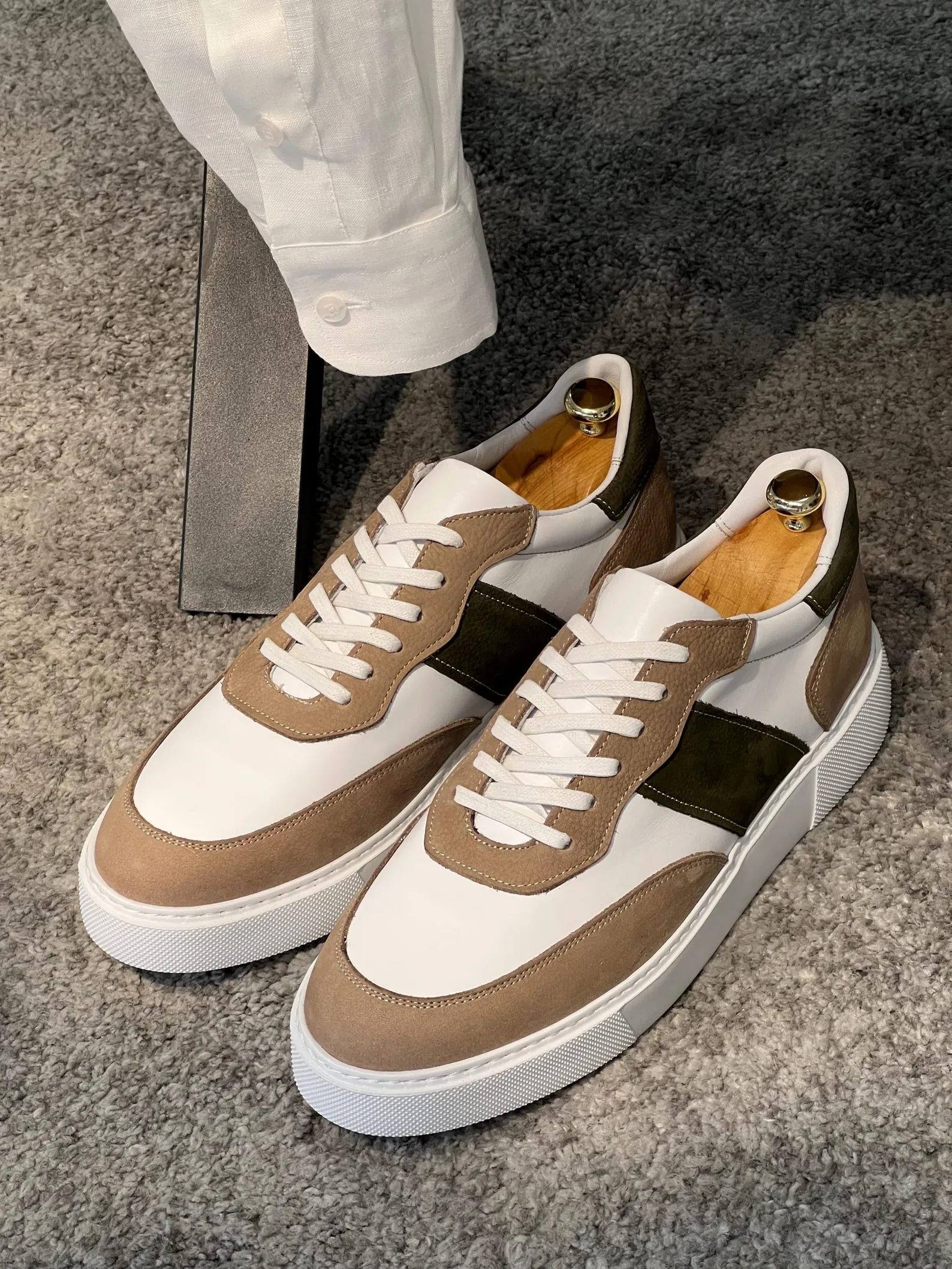 Stylish beige suede loafers with gold bit accents, perfect for classy and sophisticated occasions.